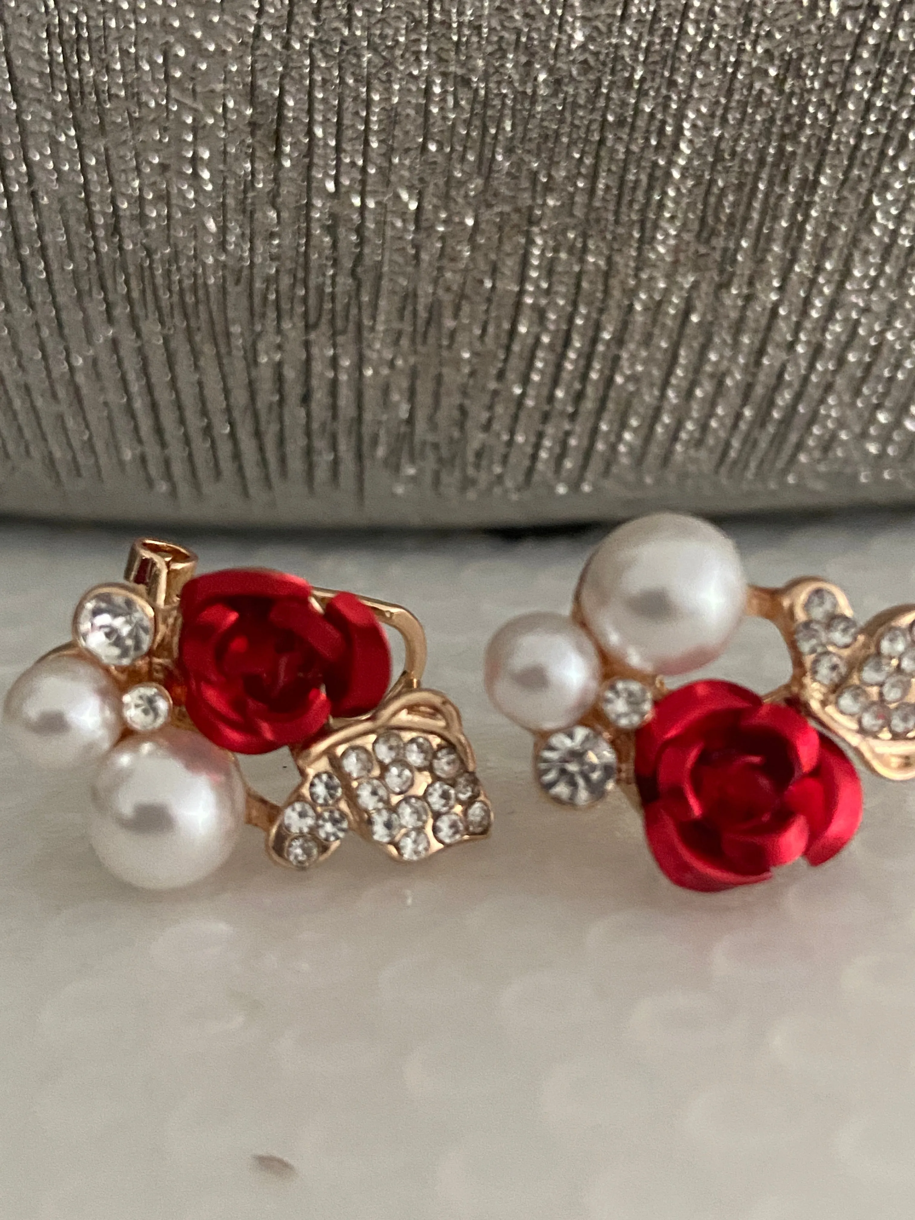 Gorgeous rose shape Earrings with white pearls.